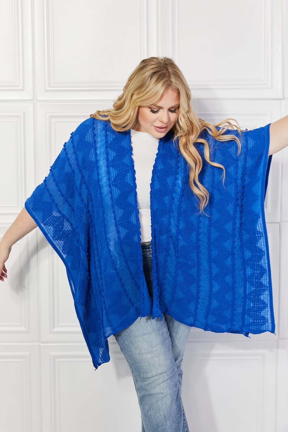 JUSTIN TAYLOR Pom-Pom Asymmetrical Poncho Cardigan in Blue at Bella Road