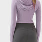 Back view of woman wearing Millennia Zip Up Hooded Long Sleeve Active Outerwear in stylish lavender color, perfect for active lifestyle.