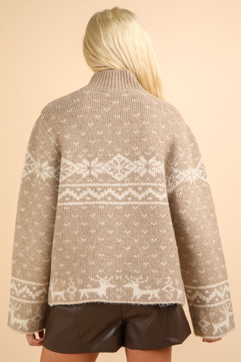 Festive mock neck sweater with reindeer and snowflake design, perfect for adding Christmas cheer to winter wardrobe.