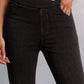 Petite black skinny jeans with pockets, moderate stretch material, flattering fit, made from polyester, cotton, and elastane.