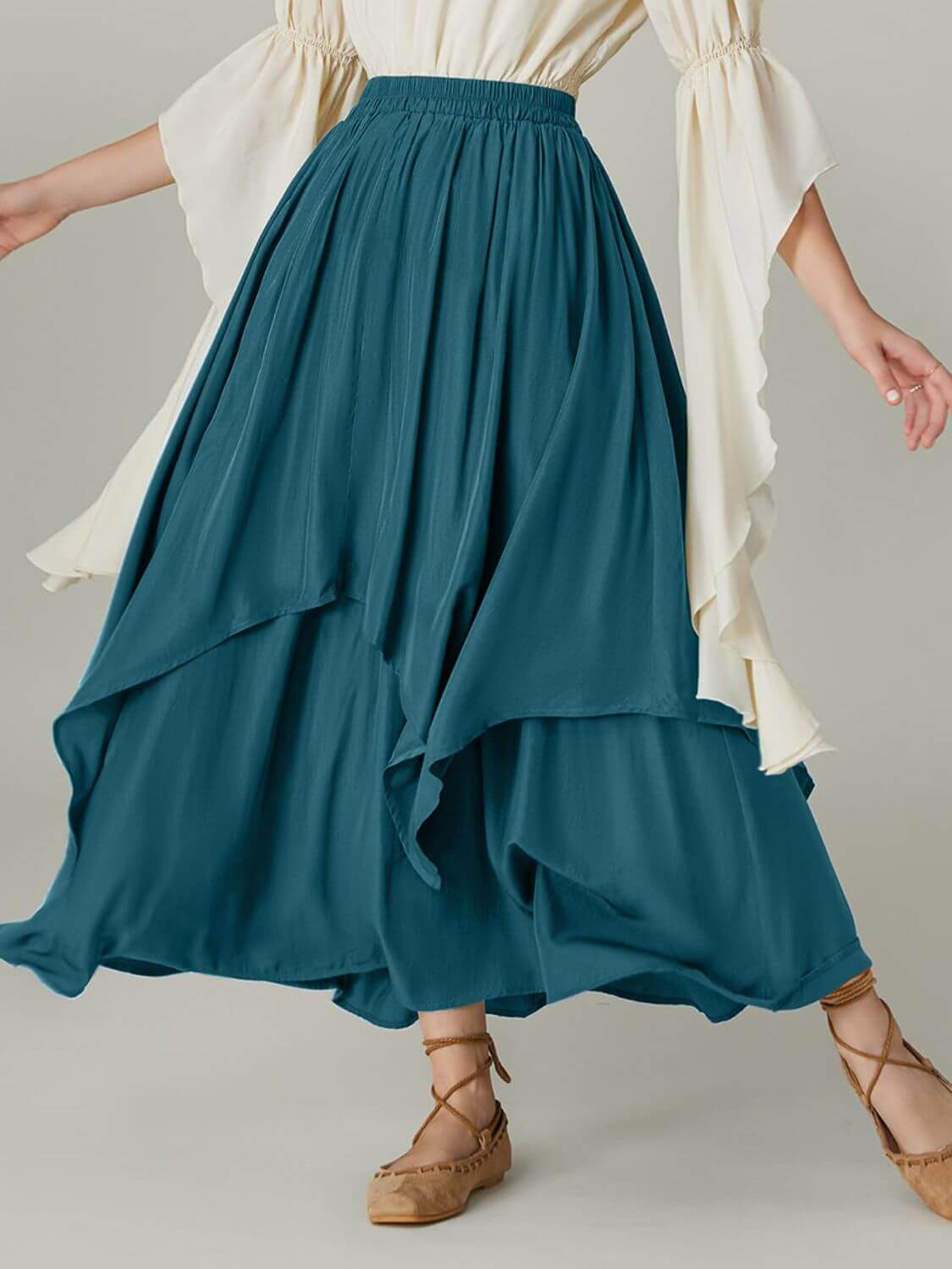 Fashionable Bella Road teal skirt with smocked waist band and ruched layers, perfect for any stylish occasion.