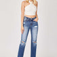 Raw hem distressed straight jeans with edgy details and classic fit by Risen Jeans, styled with a white crop top for a chic, urban look.