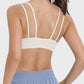 Back view of Millennia Scoop Neck Double Strap Active Cami showcasing its double strap design and playful appeal.