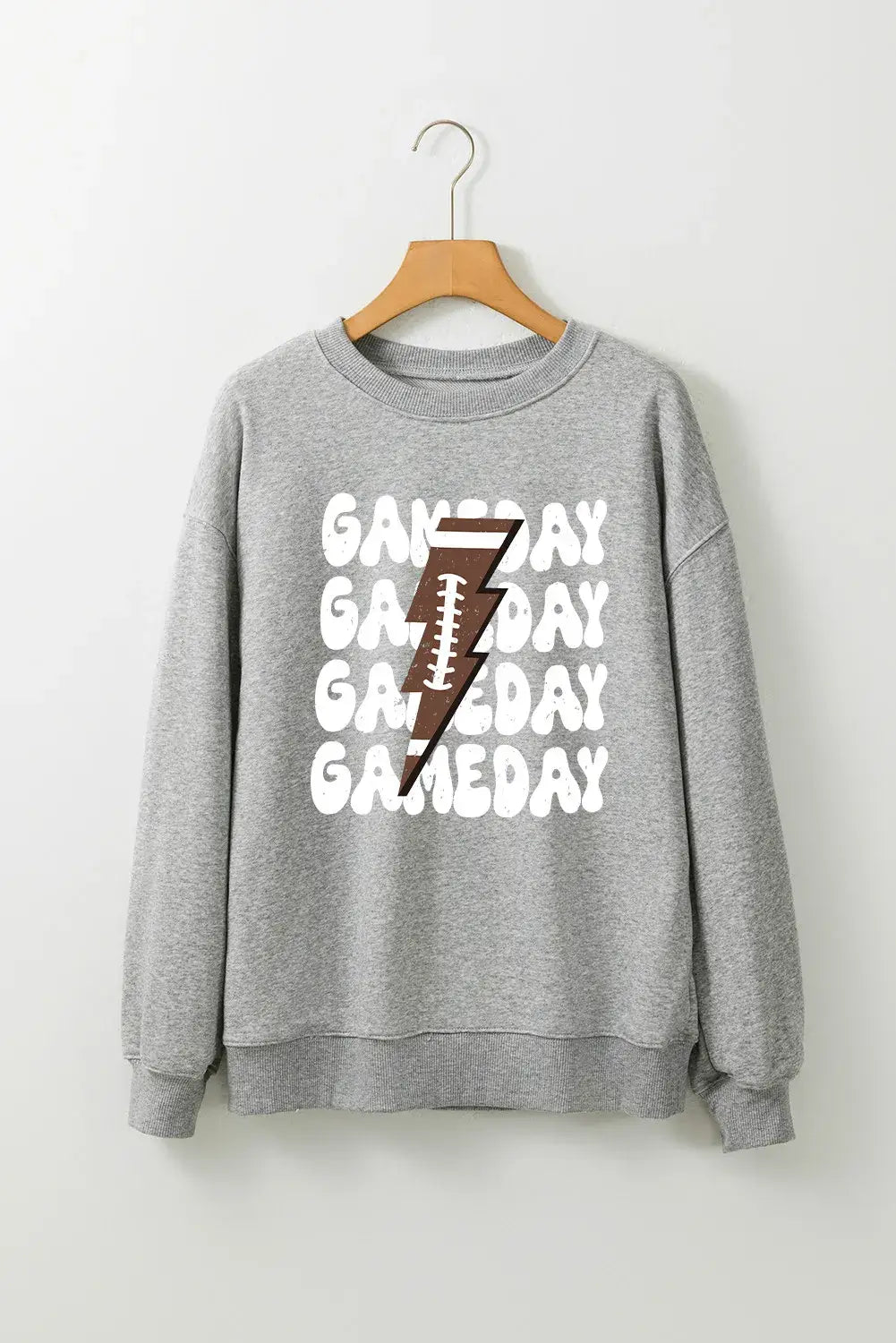 Bella Road Game Day grey round neck long sleeve sweatshirt with "Game Day" text and football graphic on hanger.