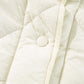 Close-up of ivory Bella Road Snap Down Texture Vest Coat with snap detail and quilted design.