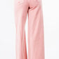 Back view of American Bazi high waist distressed wide leg jeans in pink, showcasing relaxed fit and stylish design.