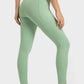 Millennia V-Waist Yoga Leggings in soft green, showcasing a flattering fit and pockets, ideal for yoga and workouts.