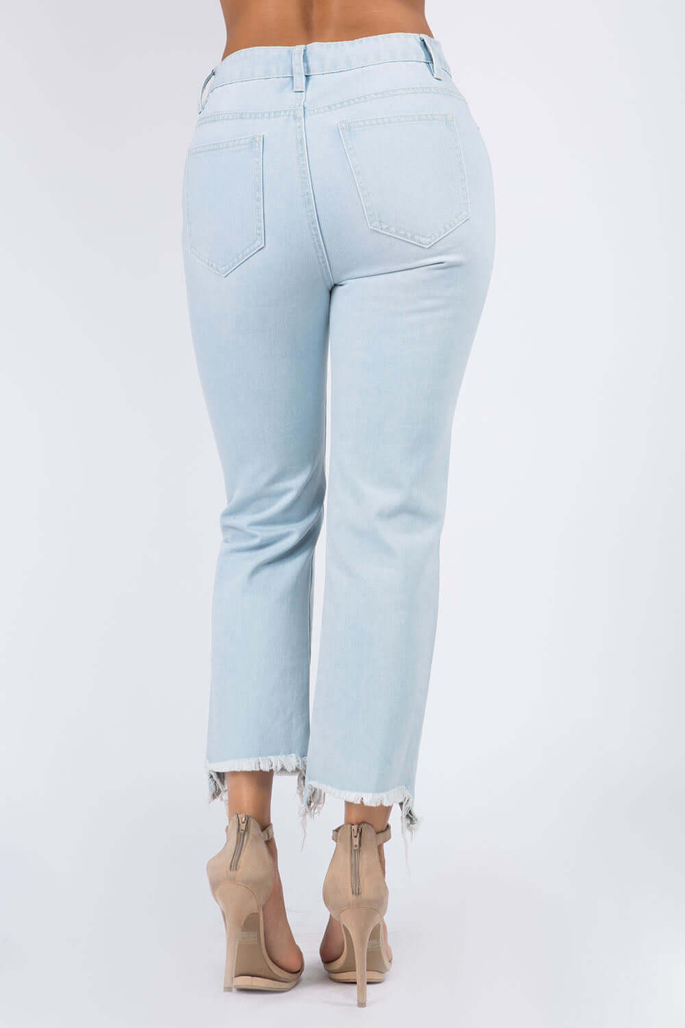 Back view of High Waist Distressed Raw Hem Jeans in light blue, featuring raw hem and distressed details for a stylish and trendy look