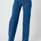 High rise straight leg Judy Blue jeans, elongating legs and accentuating waist, versatile for casual or dressy occasions.