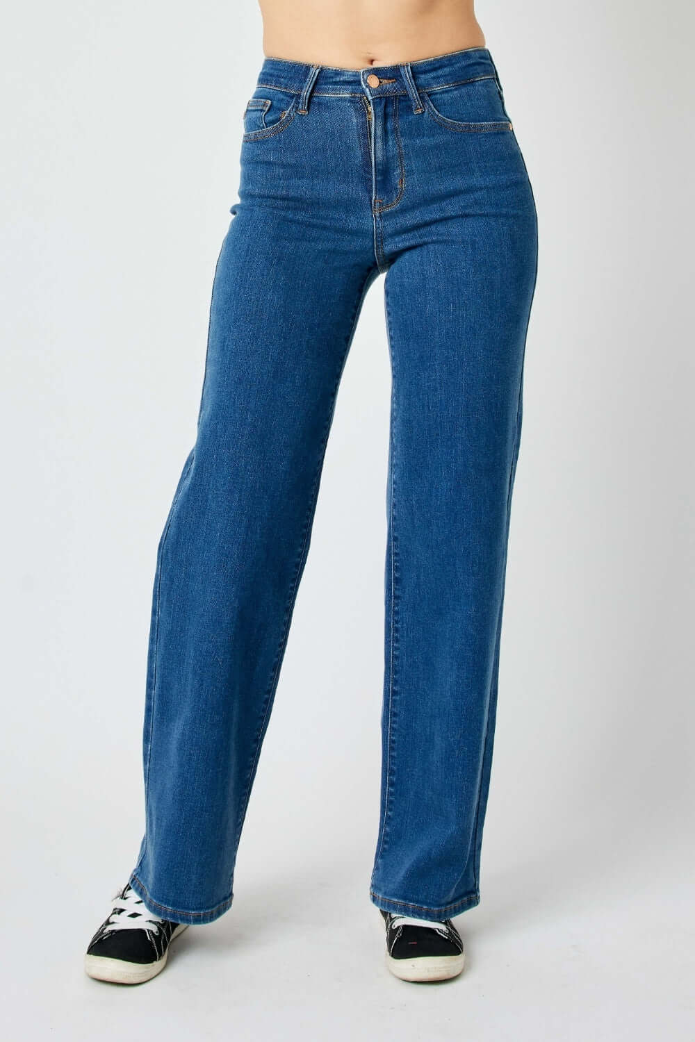 High rise straight leg Judy Blue jeans, elongating legs and accentuating waist, versatile for casual or dressy occasions.