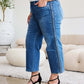 Wide leg jeans with braid side detail by Judy Blue Jeans styled with black high heels.