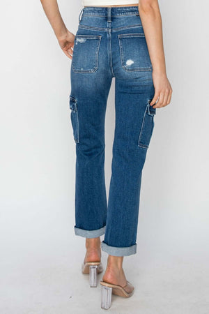 Risen high-rise cargo jeans with roll-up ankle and utilitarian pockets, showcasing stylish and trendy design.