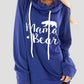 Woman wearing Bella Road Drawstring Letter Graphic Long Sleeve Hoodie with "Mama Bear" print, in blue.