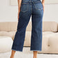 Woman wearing Tummy Control High Waist Raw Hem RFM Jeans for a stylish and flattering look