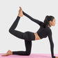 Model demonstrating yoga pose in Millennia Ruched Cropped Long Sleeve Sports Top on a pink mat.