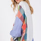 SAGE + FIG Contrast Peace Patch Dropped Shoulder Sweatshirt with colorful patchwork sleeves, perfect for casual style.