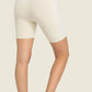 Model showcasing Millennia Seamless High-Rise Wide Waistband Biker Shorts in light color, perfect for comfort and style.