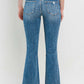 Mid Rise Distressed Cropped Flare Jeans back view showing mid-rise waist, distressed details, and cropped flare leg style