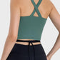 Stylish back view of Millennia Crisscross Grecian Neck Active Cami in green, featuring a unique crisscross design for gym wear.