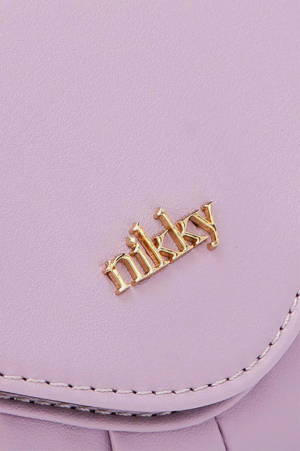 Close-up of Nicole Lee USA Graphic Crossbody Bag in lavender with gold Nikky logo detail.