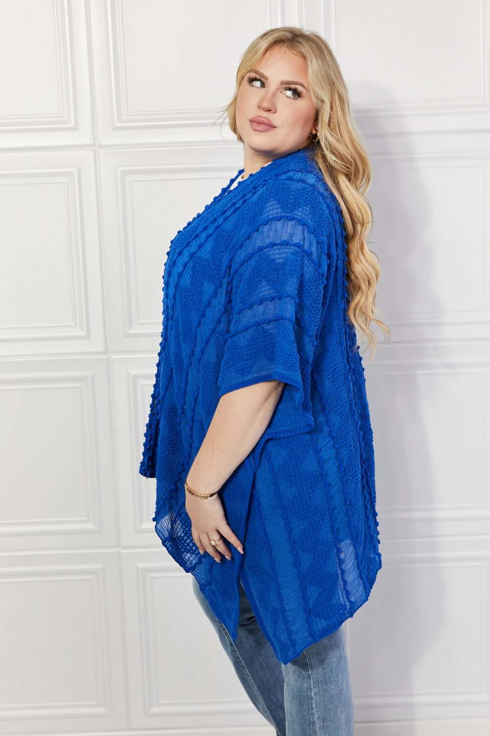 JUSTIN TAYLOR Pom-Pom Asymmetrical Poncho Cardigan in Blue at Bella Road