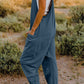 DOUBLE TAKE Full Size V-Neck Sleeveless Jumpsuit with Pockets at Bella Road