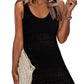 Woman in black openwork scoop neck cover up, holding a clutch, perfect for beach days and sunny outings.