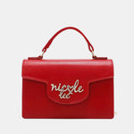 Red Nicole Lee USA small crossbody wallet with handle and gold logo on front, made of vegan leather.