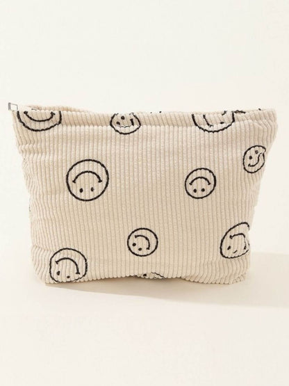 Stylish Zenana Corduroy Smile Clutch Bag featuring a cute smiley face print, perfect for casual and semi-formal occasions.