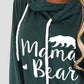 Bella Road dark green drawstring hoodie with "Mama Bear" white graphic and bear illustration on the front, close-up view