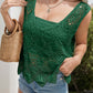 Model wearing a green Bella Road crochet cover-up with wide straps and a stylish shoulder bag.