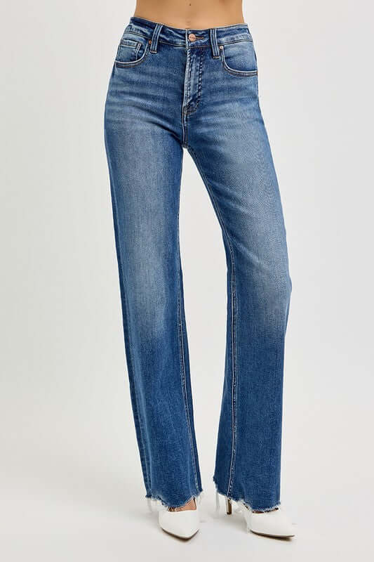 High rise raw cut jeans with tummy control for a stylish and confident look, featuring unique cut-out design.