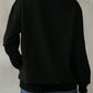 Back view of Bella Road Yellowstone Round Neck Long Sleeve Sweatshirt in black, showcasing cozy style and comfortable fit.