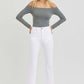 Woman modeling RISEN full size tummy control elastic band high rise crop straight jeans in white.