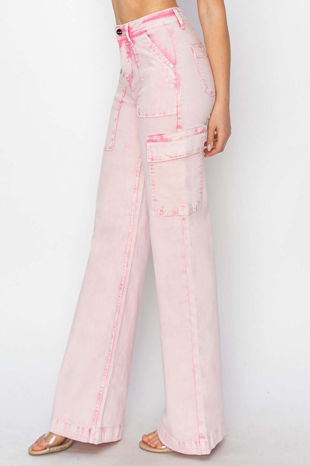 High-rise wide leg jeans with pink wash and cargo pockets, showcasing a trendy and relaxed fit, ideal for casual outfits.