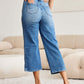 Model wearing Judy Blue braid side detail wide leg jeans showcasing back view and braid detailing with wide leg silhouette