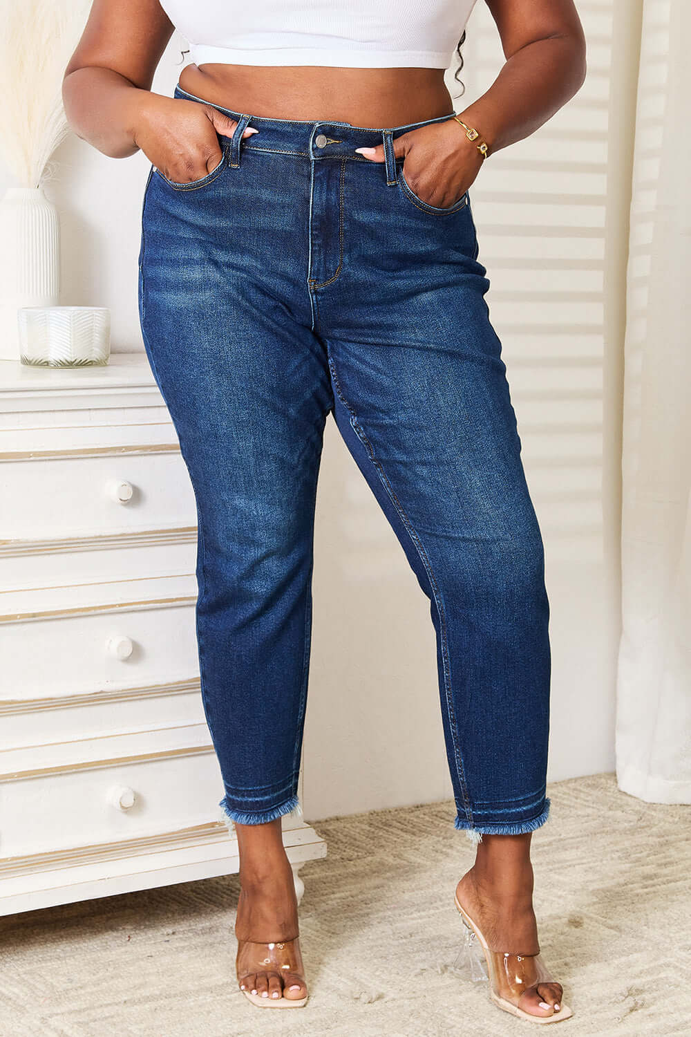 High Waist Released Hem Slit Jeans in Deep Indigo Wash by Judy Blue Jeans modeling full-size showing flattering fit and slim silhouette