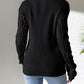 Woman wearing Bella Road Openwork V-Neck Long Sleeve Sweater in black, showcasing back design and stylish openwork sleeves.