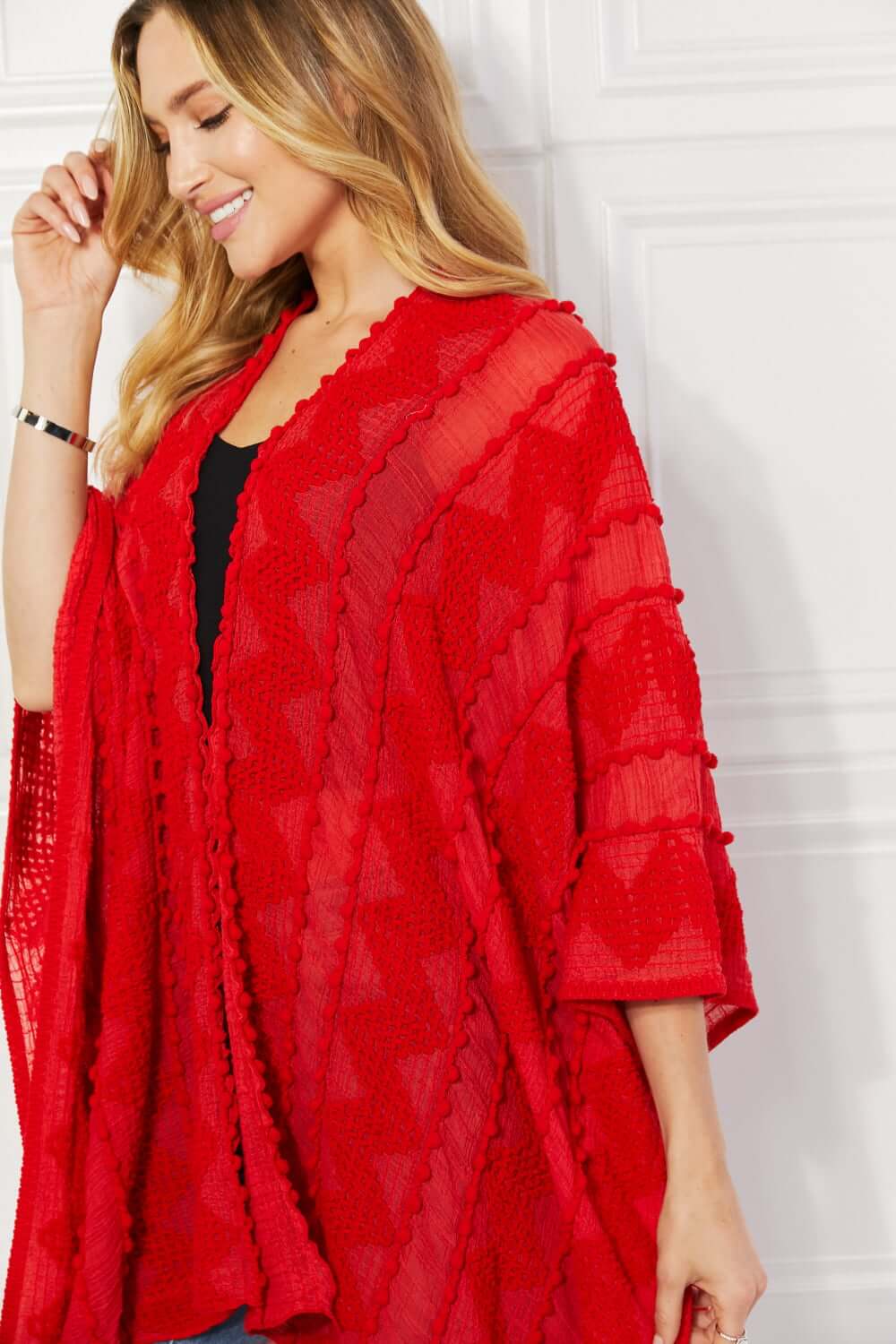 JUSTIN TAYLOR Pom-Pom Asymmetrical Poncho Cardigan in Red at Bella Road