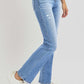 Risen full size distressed high-rise ankle straight jeans with a vintage vibe and comfortable fit, paired with white sneakers.