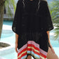 Woman wearing Slit Openwork V-Neck Half Sleeve Cover-Up with multicolor striped hem by the pool.