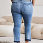 Woman wearing Judy Blue release hem cropped bootcut jeans, rear view, showcasing trendy denim fashion.