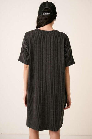 Back view of a woman wearing a Mittoshop Urban Rib Knit Short Sleeve Tee Dress with a trendy cap.