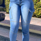 Bella Road medium wash skinny jeans with pockets, perfect blend of style and functionality for everyday wear.