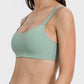 Side view of Millennia Scoop Neck Double Strap Active Cami in mint green, featuring a scoop neck and playful double straps.