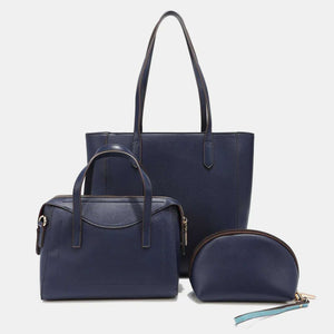 Nicole Lee USA 3-Piece Color Block Handbag Set in navy blue featuring a large shopper, mini crossbody bag, and pouch with wristlet strap.