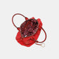 Open Nicole Lee USA Scallop Stitched Boston Bag in red, showcasing spacious interior with patterned lining.