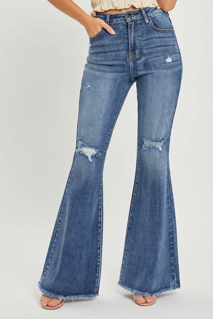 High waist distressed flare jeans by Risen Jeans with trendy urban chic detailing and flattering fit for a retro-inspired stylish look.