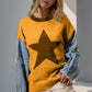 Stylish woman in Double Take Star Pattern Sweater with raw edge sleeves, perfect for a quirky, standout fashion look.