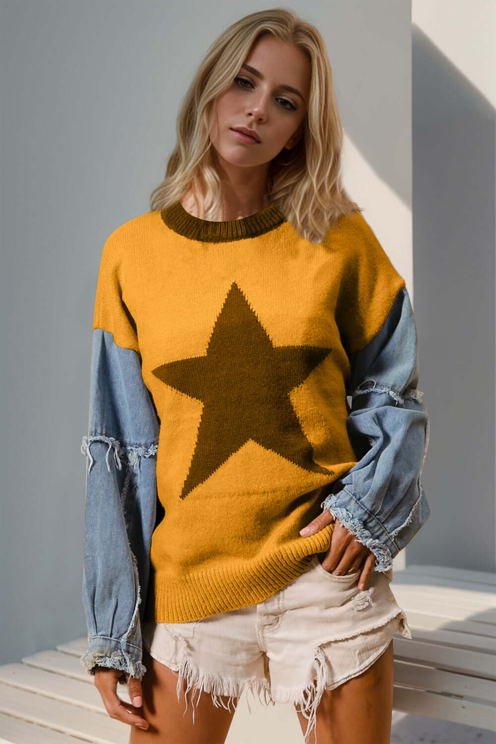 Stylish woman in Double Take Star Pattern Sweater with raw edge sleeves, perfect for a quirky, standout fashion look.